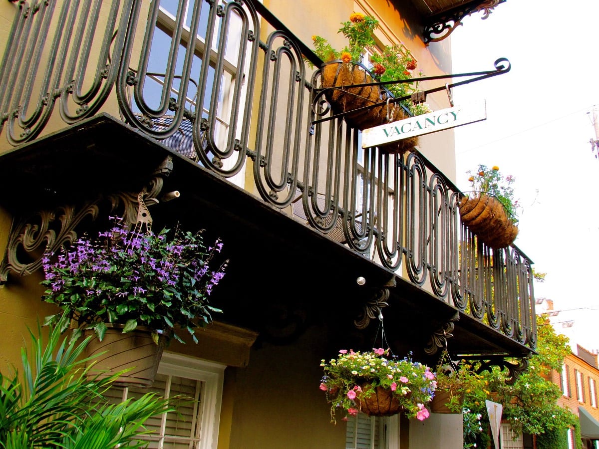 A wrought-iron balcony on a Savannah townhouse